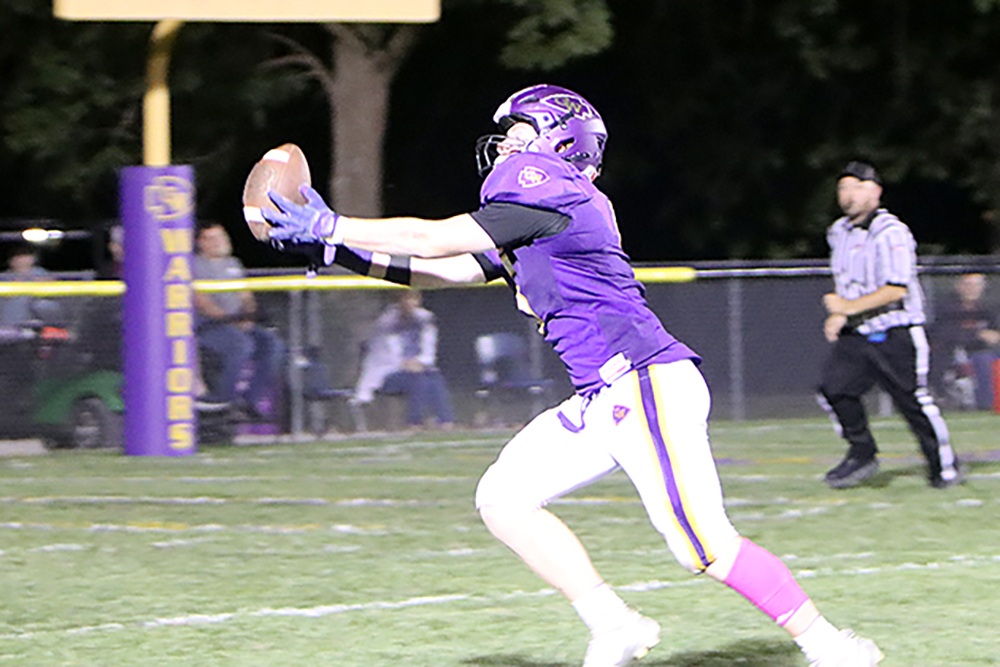 Casey-Westfield's Daryn Hupp hauls in a fingertip touchdown pass from quarterback Nolan Clement during Friday's game against Marshall. The spectacular 26-yard reception was a pivotal fourth-quarter play that led to the game-tying two-point conversion, sparking the Warriors' comeback victory.(Photo by Terri Cox)
