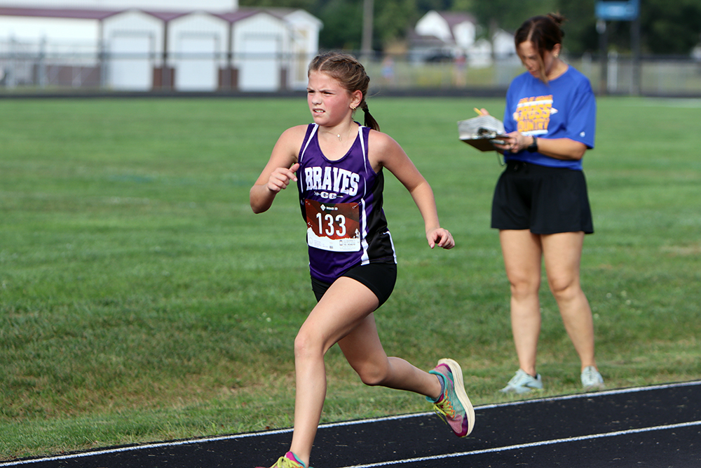 Emmy Kusterman, a fifth-grader for the Lady Braves, posted a strong time of 15:35.38 to finish 21st overall at Wednesday's cross country meet in Toledo. (Photo by Terri Cox)