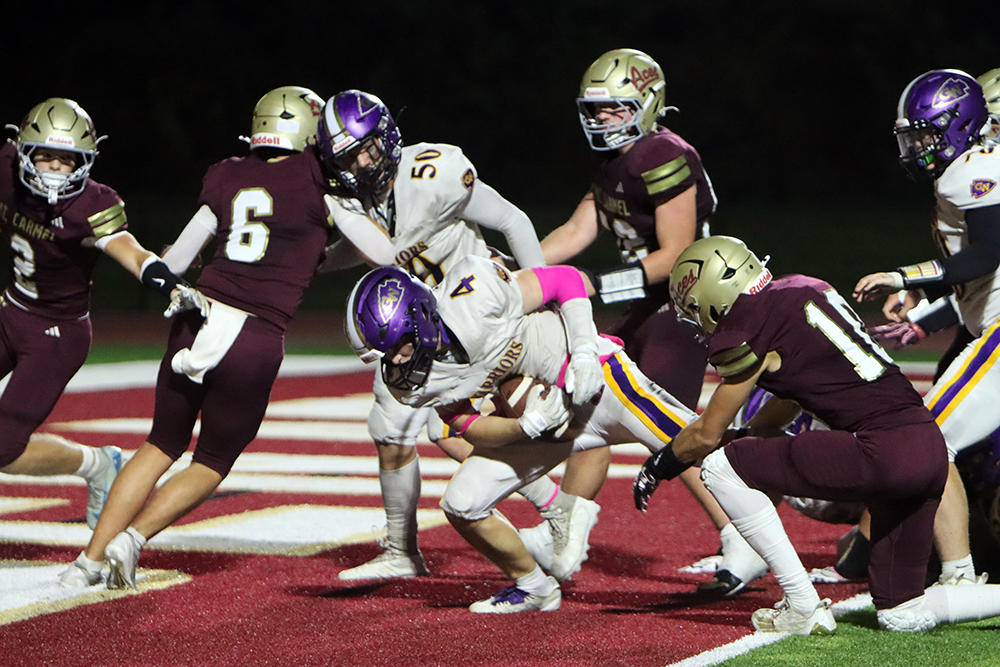 00KellenSullivanScoresInOT Kellen Sullivan powers his way into the end zone for the go-ahead touchdown in overtime, giving Casey-Westfield the crucial 21-20 lead. —photo by Terri Cox