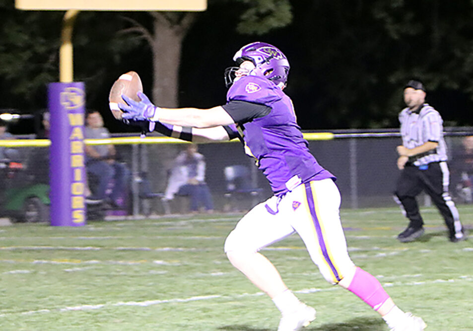 Casey-Westfield's Daryn Hupp hauls in a fingertip touchdown pass from quarterback Nolan Clement during Friday's game against Marshall. The spectacular 26-yard reception was a pivotal fourth-quarter play that led to the game-tying two-point conversion, sparking the Warriors' comeback victory.(Photo by Terri Cox)