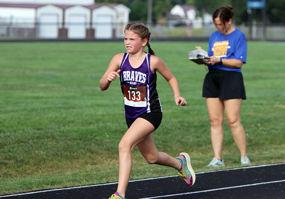 Emmy Kusterman, a fifth-grader for the Lady Braves, posted a strong time of 15:35.38 to finish 21st overall at Wednesday's cross country meet in Toledo. (Photo by Terri Cox)