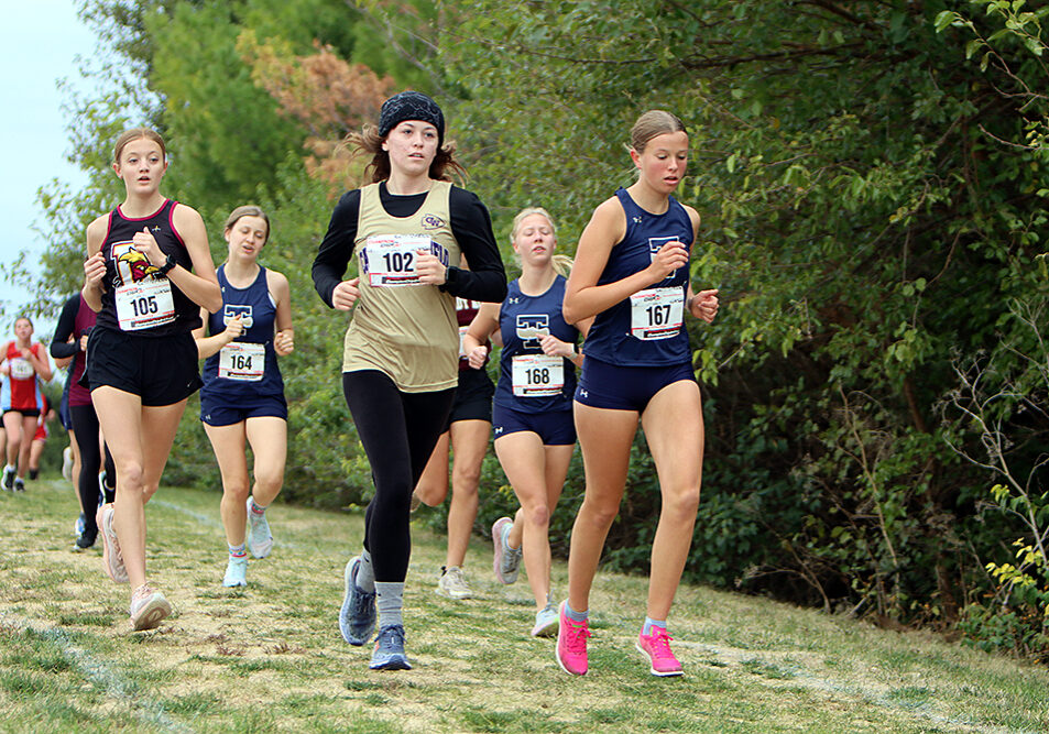 Kaitlyn McKinney runs for the Lady Warriors at the regional meet. McKinney’s time of 23:33.0 was a key part of the team's seventh-place finish, which secured a berth in the Sectional. —photo by Terri Cox