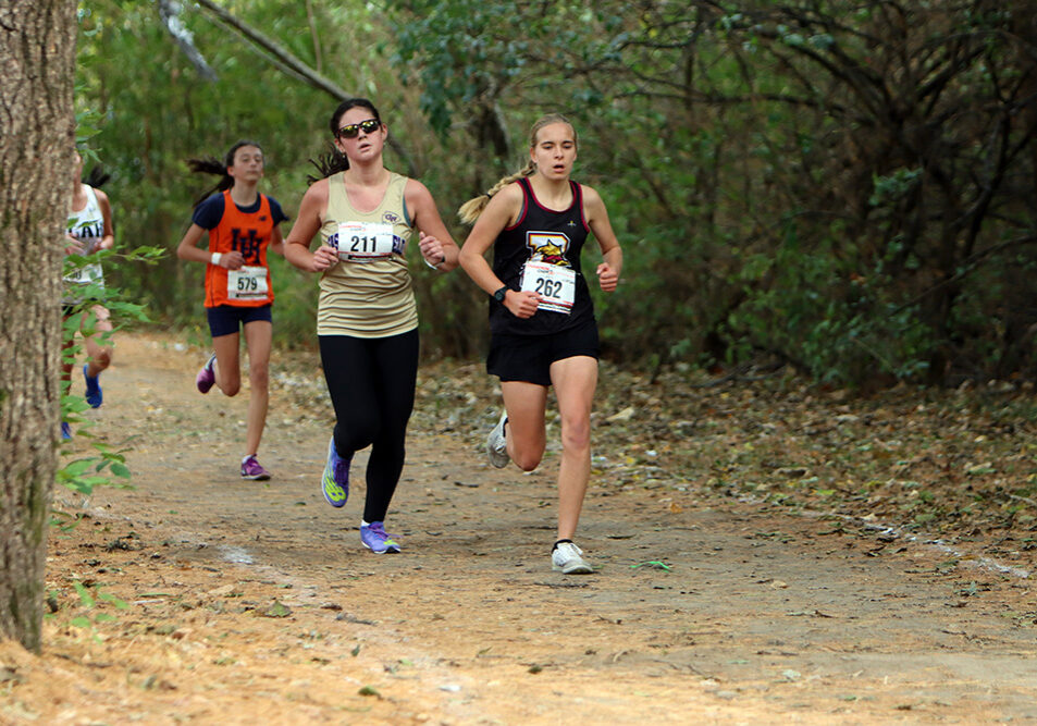 In her final career race, Lady Warrior Kayla Clark leads the Casey-Westfield runners at the IHSA 1A Sectional meet. Clark capped her career with an impressive 29th-place finish and a time of 19:45.9. —photo by Terri Cox