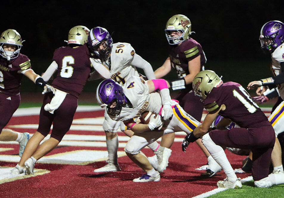 Kellen Sullivan powers his way into the end zone for the go-ahead touchdown in overtime, giving Casey-Westfield the crucial 21-20 lead. —photo by Terri Cox