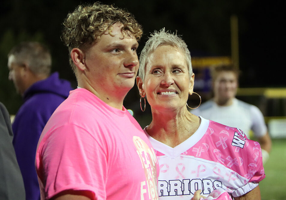 Wyatt Erickson wears a special jersey honoring Vicki Yates during Friday night's "Pink-Out" game.